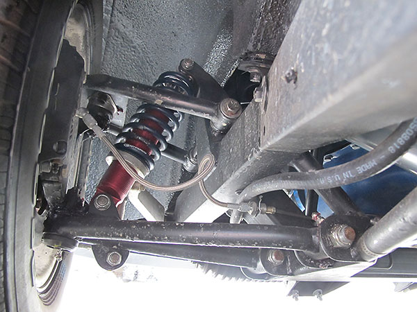 Unequal length, non-parallel control arms.